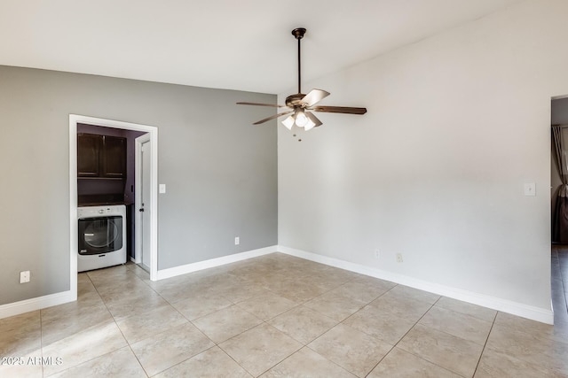 empty room featuring washer / clothes dryer, light tile patterned floors, vaulted ceiling, and ceiling fan