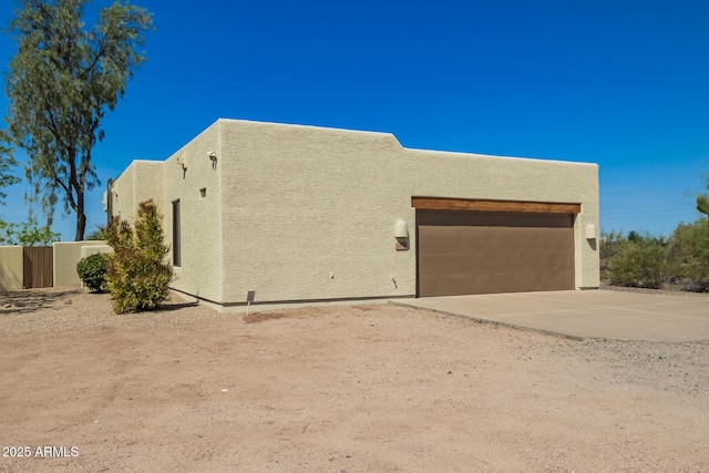 26650 N 57th St N, Scottsdale, AZ 85266 - view of front of home with a garage, stucco siding, and concrete driveway