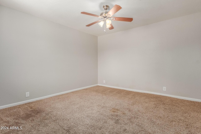 unfurnished room with ceiling fan and carpet floors