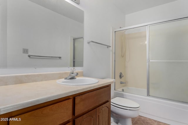 bathroom with toilet, enclosed tub / shower combo, and vanity