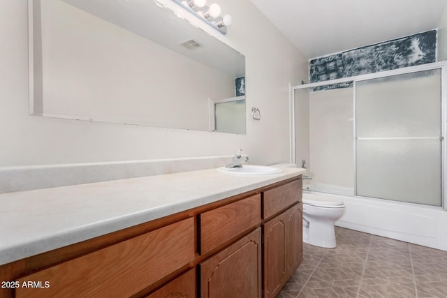 full bath with visible vents, shower / bath combination with glass door, vanity, and toilet