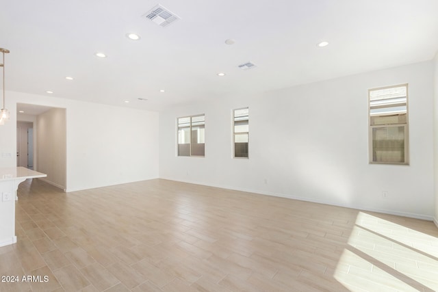 spare room featuring a wealth of natural light