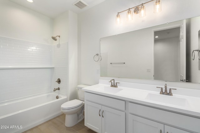 full bathroom featuring vanity, shower / bath combination, toilet, and hardwood / wood-style flooring