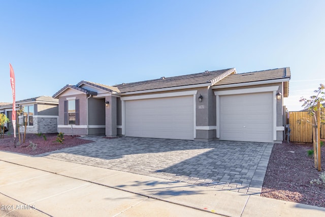 single story home featuring a garage