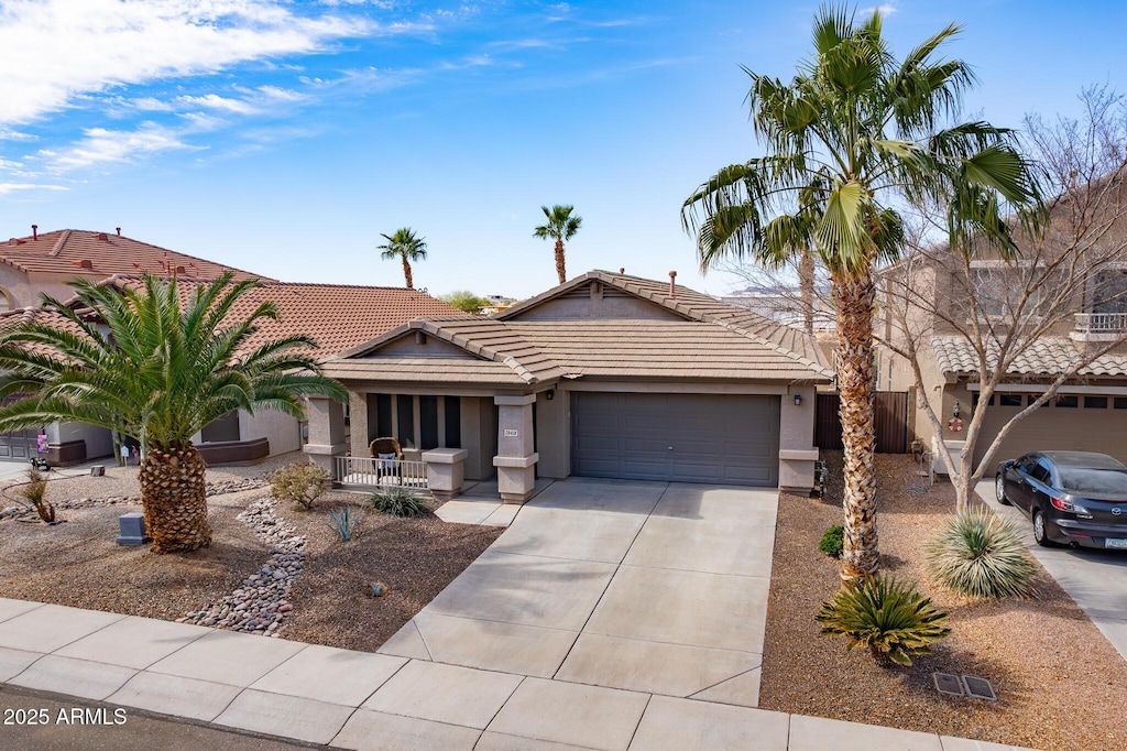 ranch-style home featuring a garage