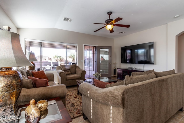 living room featuring ceiling fan and lofted ceiling