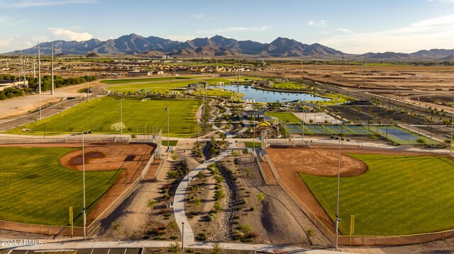 drone / aerial view with a water and mountain view