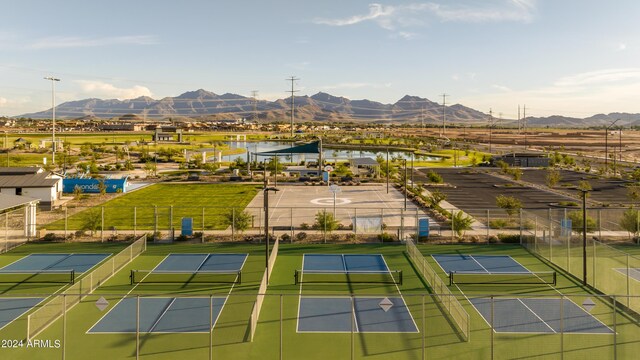 drone / aerial view with a water and mountain view