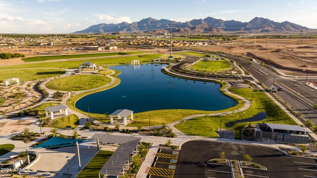 birds eye view of property with a water and mountain view