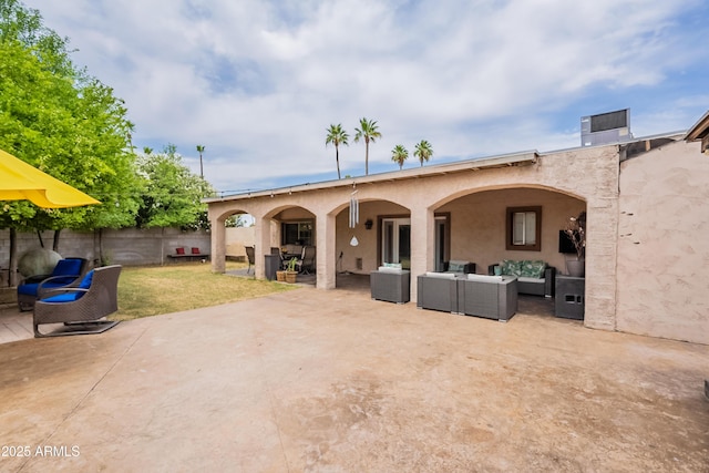 10601 N 36th St, Phoenix, AZ 85028 - back of property featuring an outdoor living space, a patio, and stucco siding
