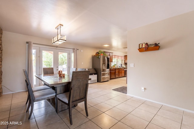 10601 N 36th St, Phoenix, AZ 85028 - dining room with french doors, light tile patterned floors, and baseboards