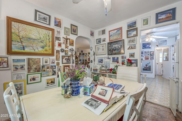 3303 E Clarendon Ave, Phoenix, AZ 85018 - dining area with ceiling fan and arched walkways