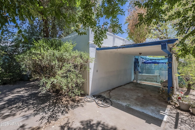 3303 E Clarendon Ave, Phoenix, AZ 85018 - view of home's exterior with a carport