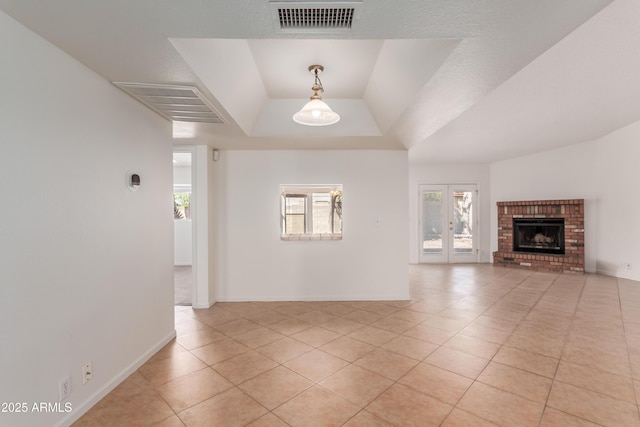 6534 S Marilyn Ann Dr, Tempe, AZ 85283 - unfurnished living room with a tray ceiling, light tile patterned floors, baseboards, and visible vents