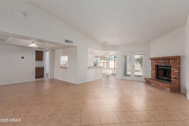 6534 S Marilyn Ann Dr, Tempe, AZ 85283 - unfurnished living room featuring visible vents, a fireplace, a textured ceiling, and baseboards