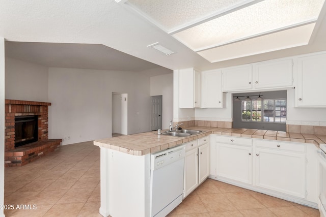 6534 S Marilyn Ann Dr, Tempe, AZ 85283 - kitchen featuring white cabinetry, a peninsula, a sink, dishwasher, and open floor plan