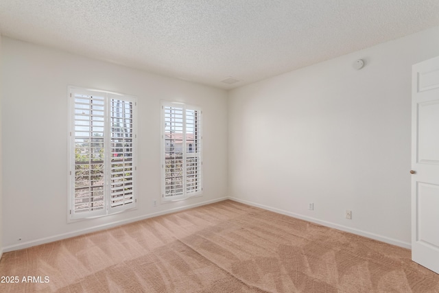 6534 S Marilyn Ann Dr, Tempe, AZ 85283 - spare room featuring baseboards, light colored carpet, and a textured ceiling