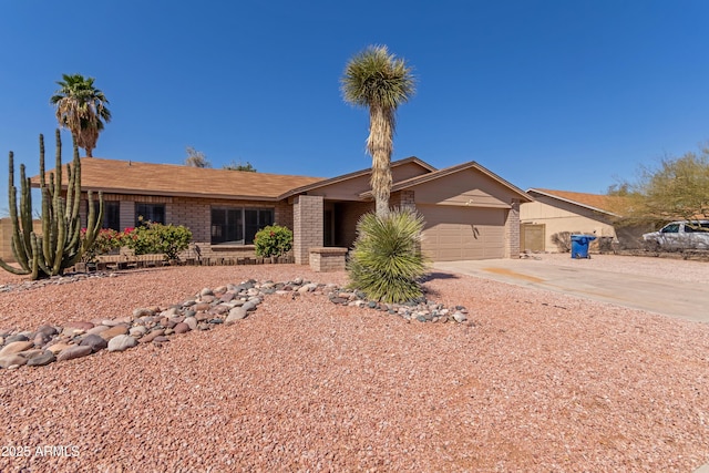 6534 S Marilyn Ann Dr, Tempe, AZ 85283 - view of front of house with a garage, brick siding, and concrete driveway
