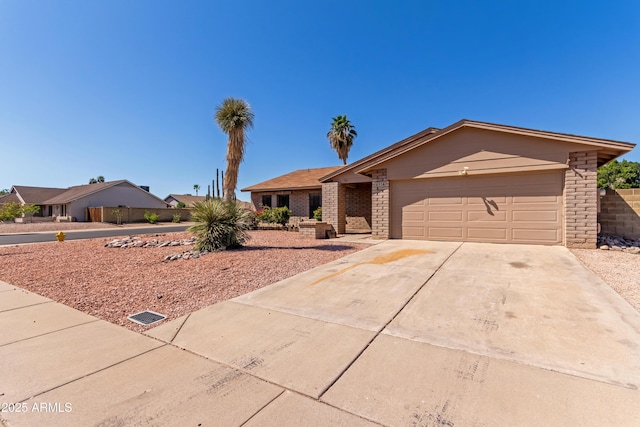 6534 S Marilyn Ann Dr, Tempe, AZ 85283 - view of front of property with brick siding, concrete driveway, and a garage