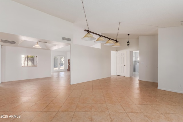 6534 S Marilyn Ann Dr, Tempe, AZ 85283 - empty room with light tile patterned floors, visible vents, and a towering ceiling