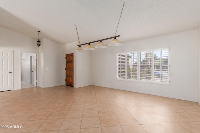6534 S Marilyn Ann Dr, Tempe, AZ 85283 - unfurnished room with vaulted ceiling, light tile patterned floors, baseboards, and a textured ceiling