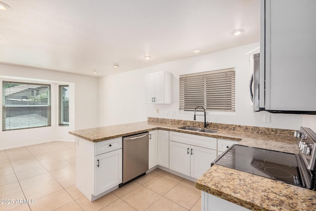 15440 S 38th St, Phoenix, AZ 85044 - kitchen featuring stainless steel appliances, a sink, a peninsula, white cabinetry, and recessed lighting
