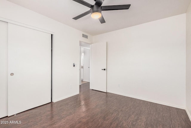 15440 S 38th St, Phoenix, AZ 85044 - unfurnished bedroom with wood finished floors, a closet, baseboards, and ceiling fan