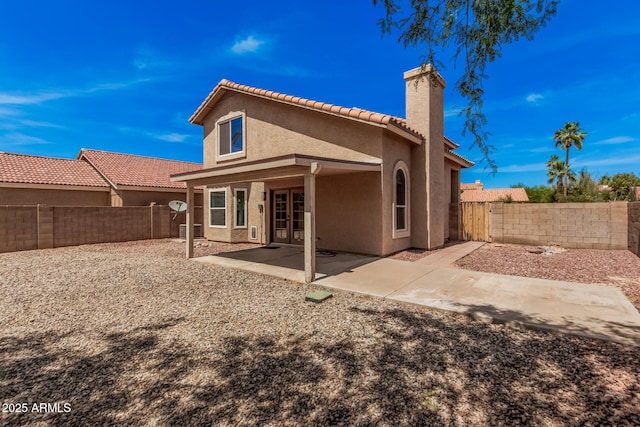 15440 S 38th St, Phoenix, AZ 85044 - back of house featuring a chimney, stucco siding, a patio area, and a fenced backyard
