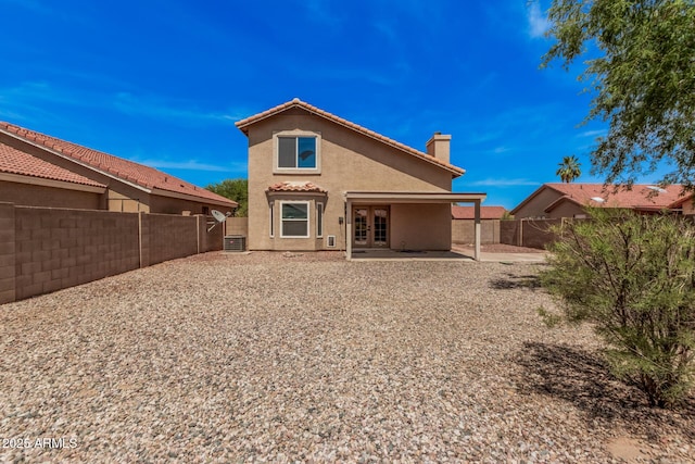 15440 S 38th St, Phoenix, AZ 85044 - back of property with stucco siding, a chimney, a patio, and a fenced backyard