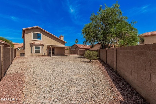 15440 S 38th St, Phoenix, AZ 85044 - rear view of property featuring stucco siding, a fenced backyard, a patio, and central AC unit