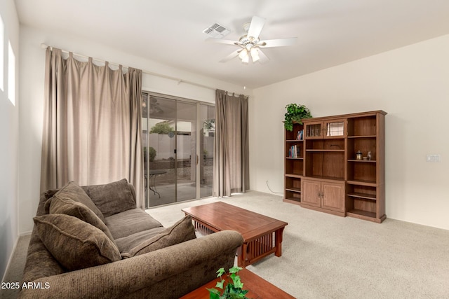 carpeted living room featuring visible vents and ceiling fan