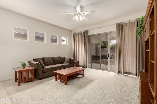 carpeted living room featuring ceiling fan