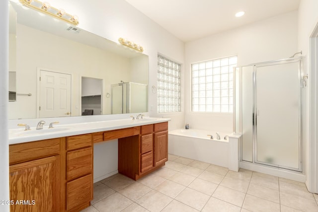 full bath with tile patterned floors, visible vents, a stall shower, a sink, and double vanity