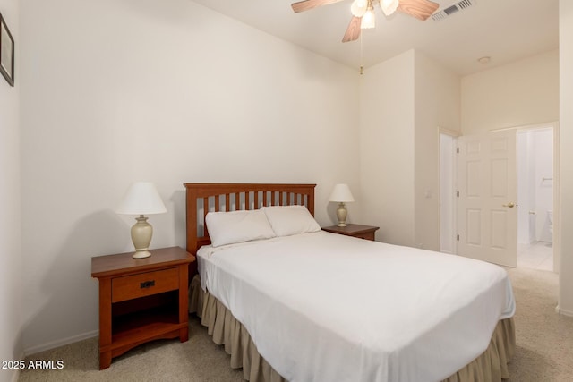 bedroom with light colored carpet, visible vents, and ceiling fan