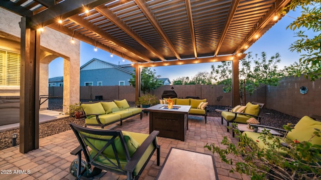 view of patio with a fenced backyard, a pergola, and an outdoor living space with a fire pit