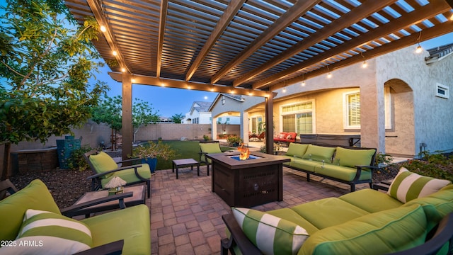 view of patio with a fenced backyard, a pergola, and an outdoor living space with a fire pit
