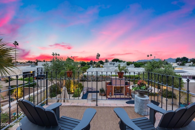 patio terrace at dusk with a balcony