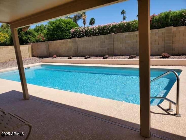 view of pool featuring a fenced backyard