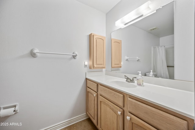 full bathroom with vanity, tile patterned flooring, a shower with shower curtain, and baseboards