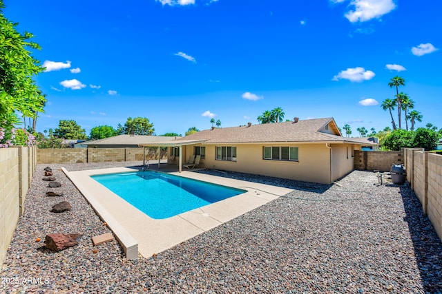 view of swimming pool featuring a patio area and a fenced backyard