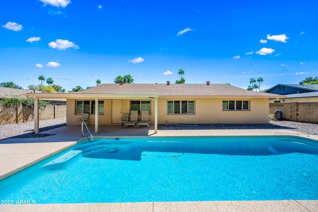 view of swimming pool featuring a patio and a fenced backyard