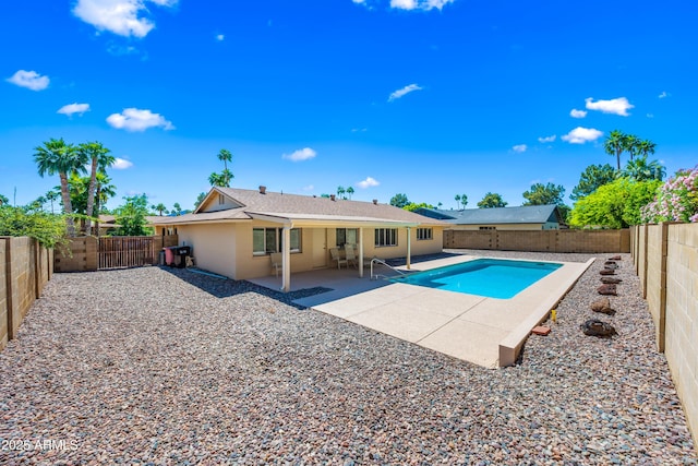 view of pool featuring a fenced backyard and a patio