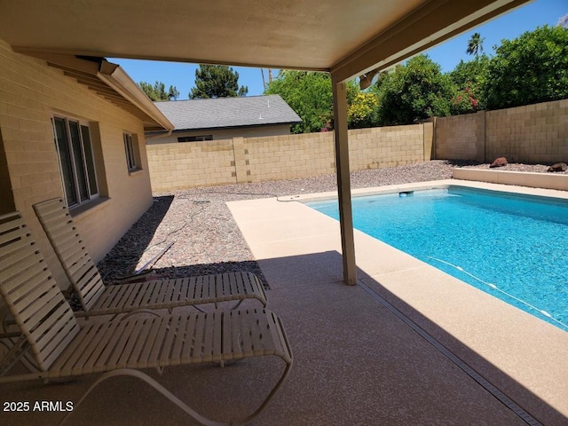 view of pool featuring a patio and a fenced backyard