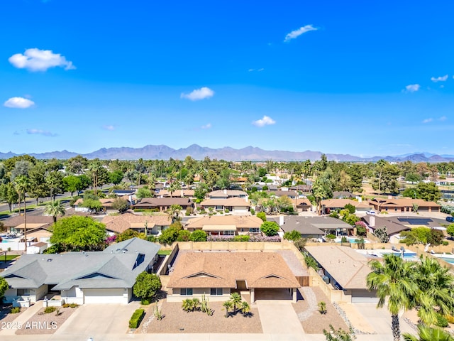 aerial perspective of suburban area featuring a mountain backdrop