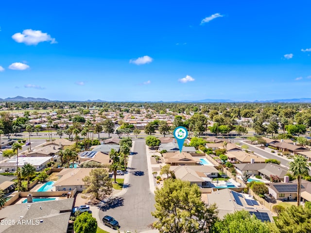 aerial view of residential area with mountains
