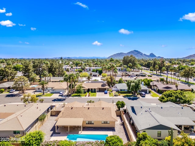 aerial view of residential area featuring mountains