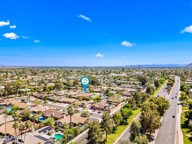 aerial view of residential area featuring a mountainous background