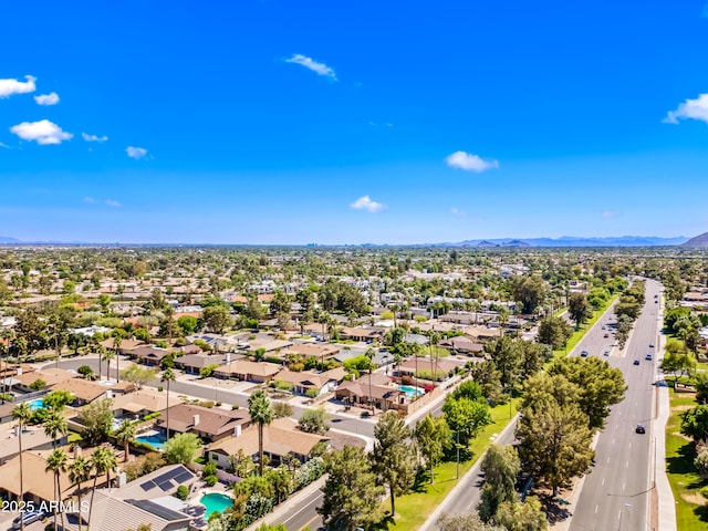 aerial view of residential area featuring a mountain backdrop
