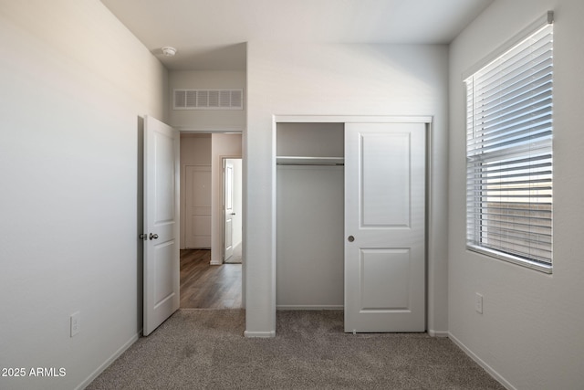 25235 N 183rd Dr, Wittmann, AZ 85361 - unfurnished bedroom featuring carpet floors, a closet, and baseboards