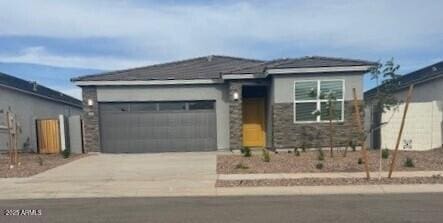 25235 N 183rd Dr, Wittmann, AZ 85361 - view of front of home featuring concrete driveway and a garage